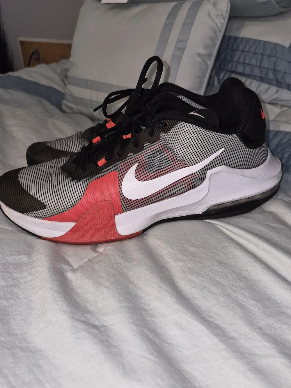 Nike Air Max Impact 4 'Black Bright Crimson' featuring a striped grey and bl